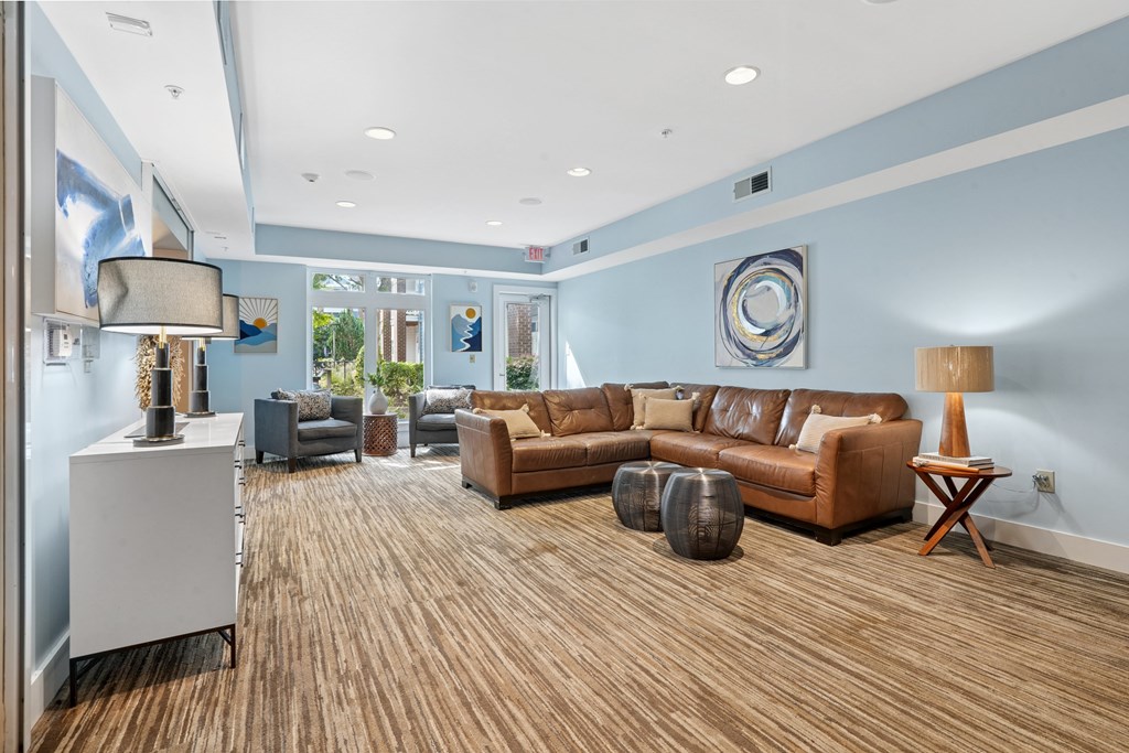 A living room with brown and grey furniture.