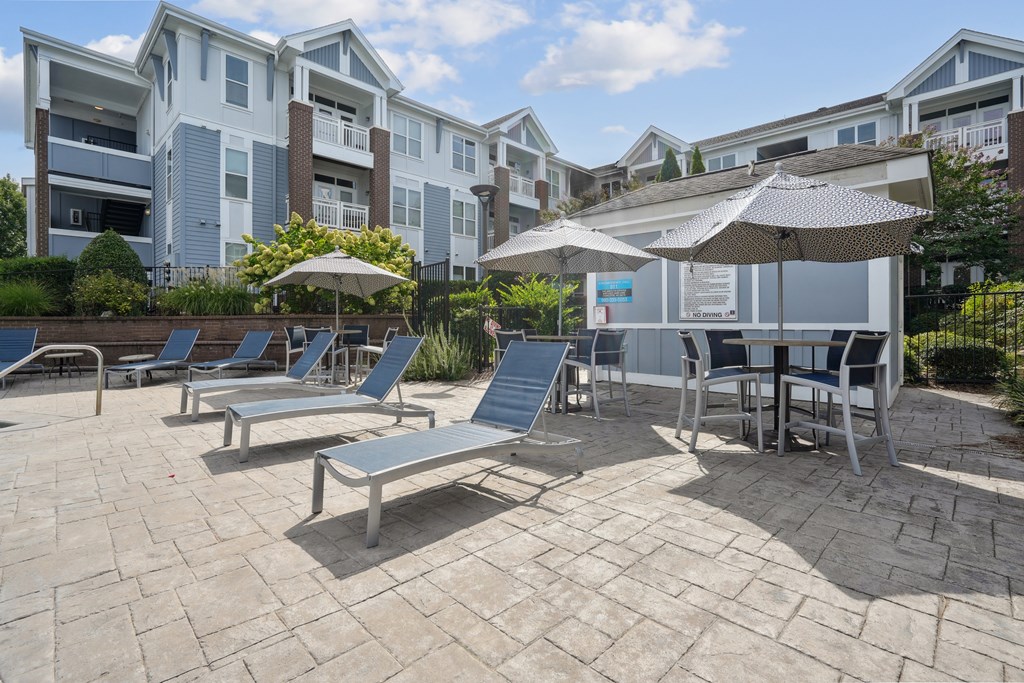 A sunny day at the outdoor seating area of a residential building.