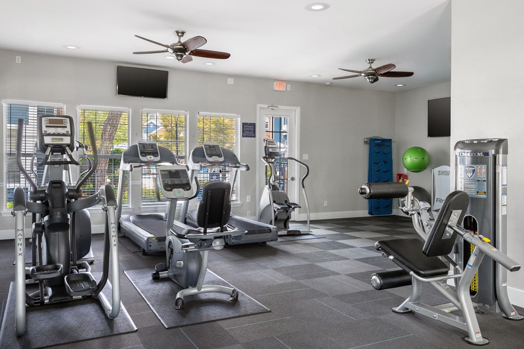 a fitness center with fitness equipment