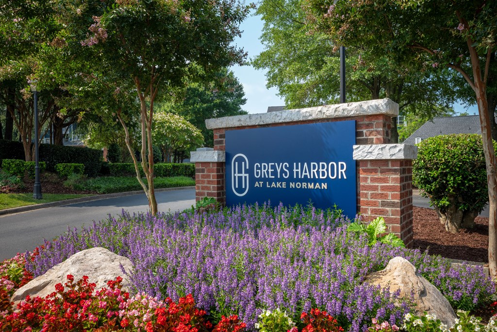 a sign for greys harbor at lake norman