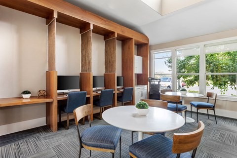 a conference room with tables and chairs and a large window
