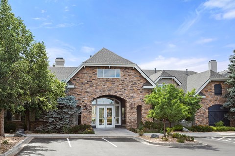 the front of a brick house with an arched door