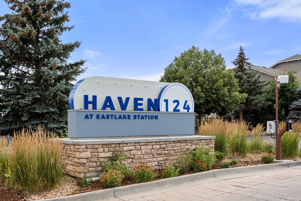 a sign for haveen 144 at eastgate station in front of trees