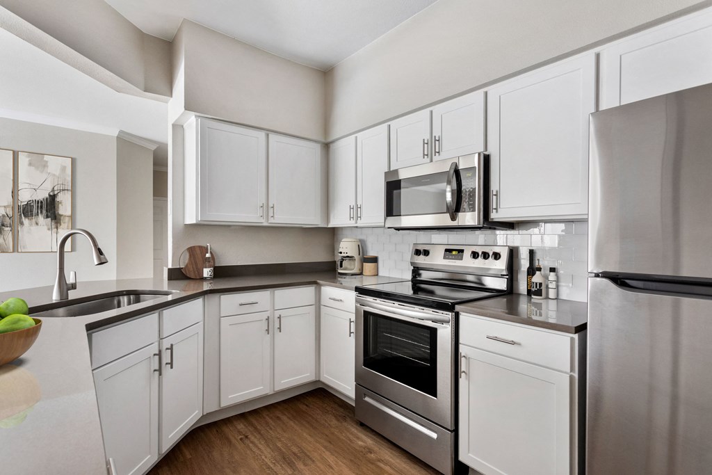 the preserve at ballantyne commons apartment kitchen with stainless steel appliances