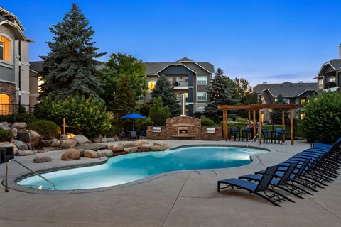our resort style swimming pool is next to our apartments in the evening