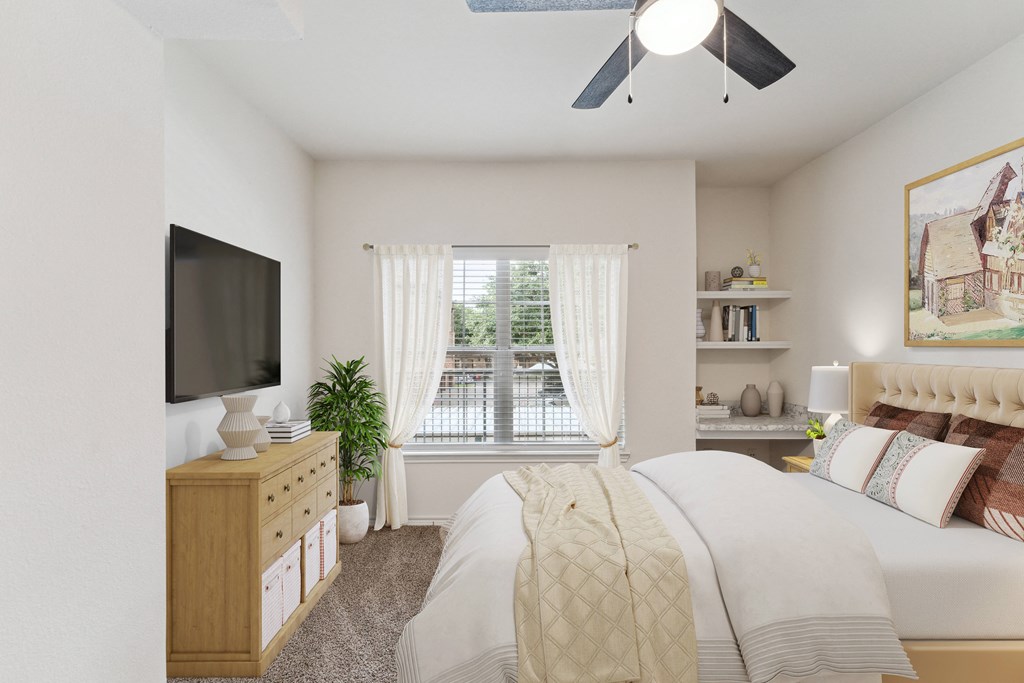 a bedroom with a bed and a tv