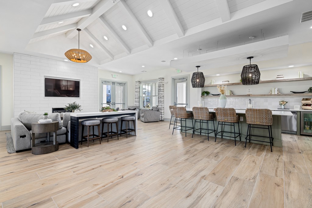 a living room with a kitchen and a dining room