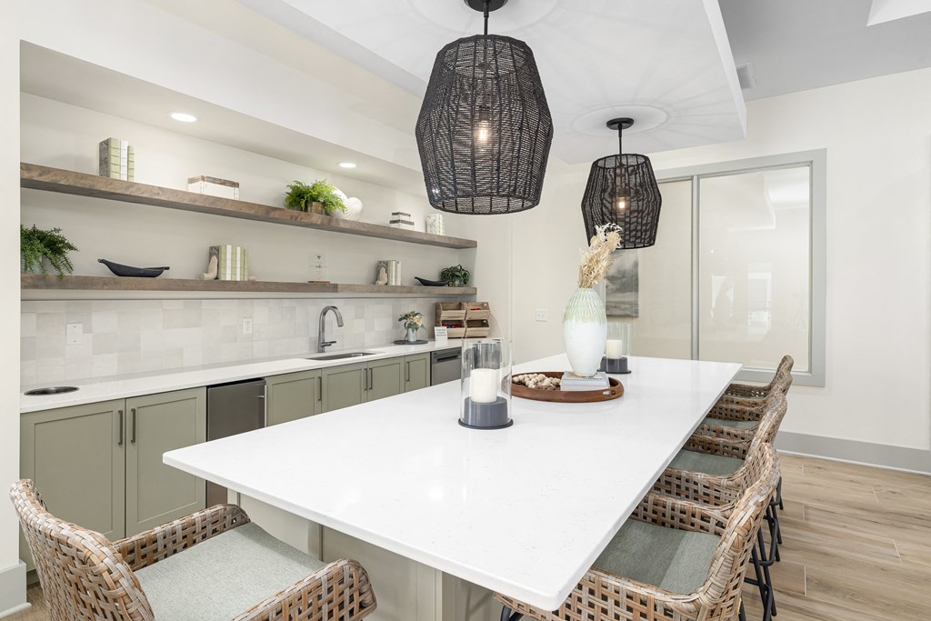 a kitchen with a white counter top and a white table