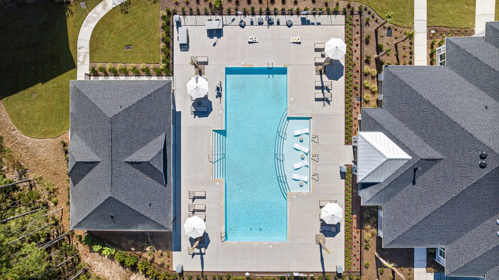 arial view of a swimming pool on the roof of a house