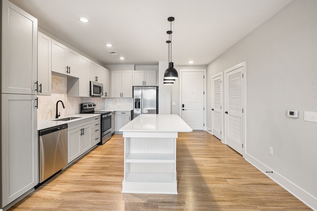 white kitchen with brown wooden floors (4)