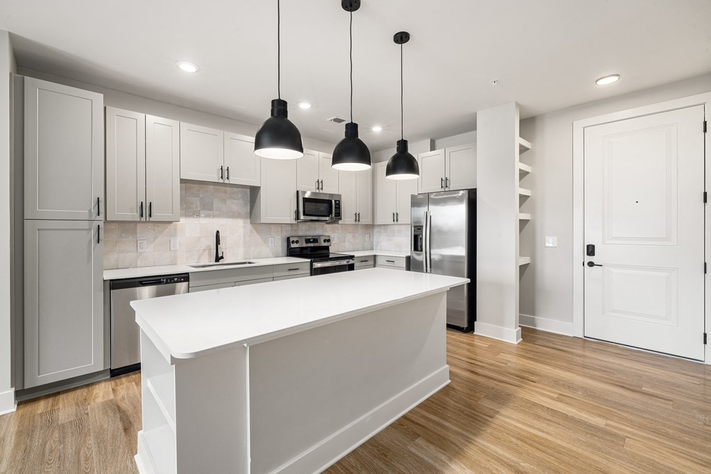 White kitchen with brown wooden floors (3)