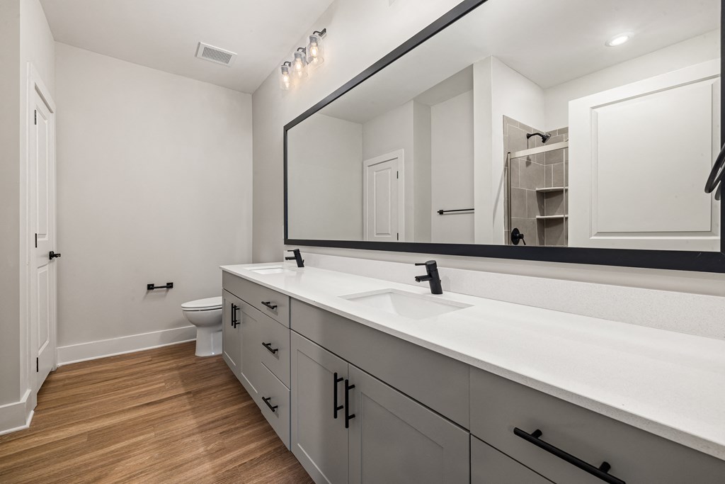 bathroom with large mirrors