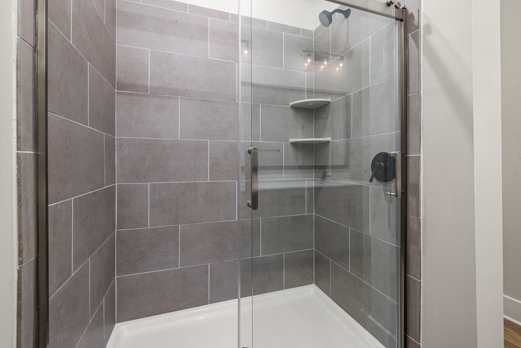 Large shower with grey bricks