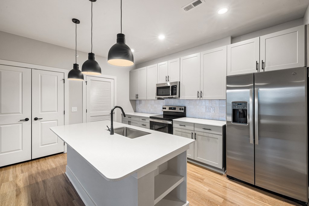 white kitchen with brown wooden floors (5)