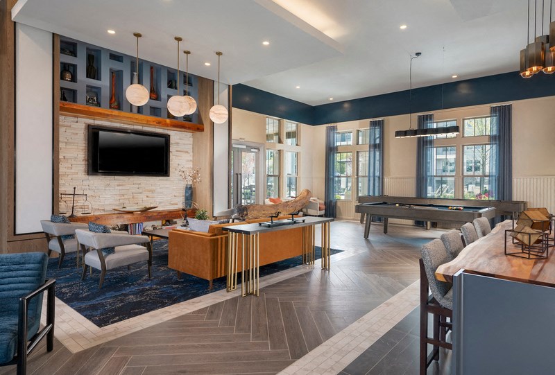 a living room with a fireplace and a ping pong table