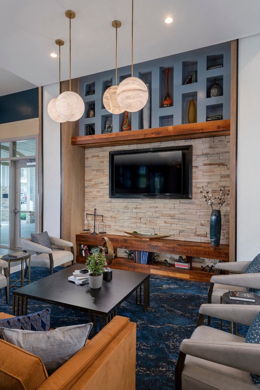 a living room with a fireplace and a television