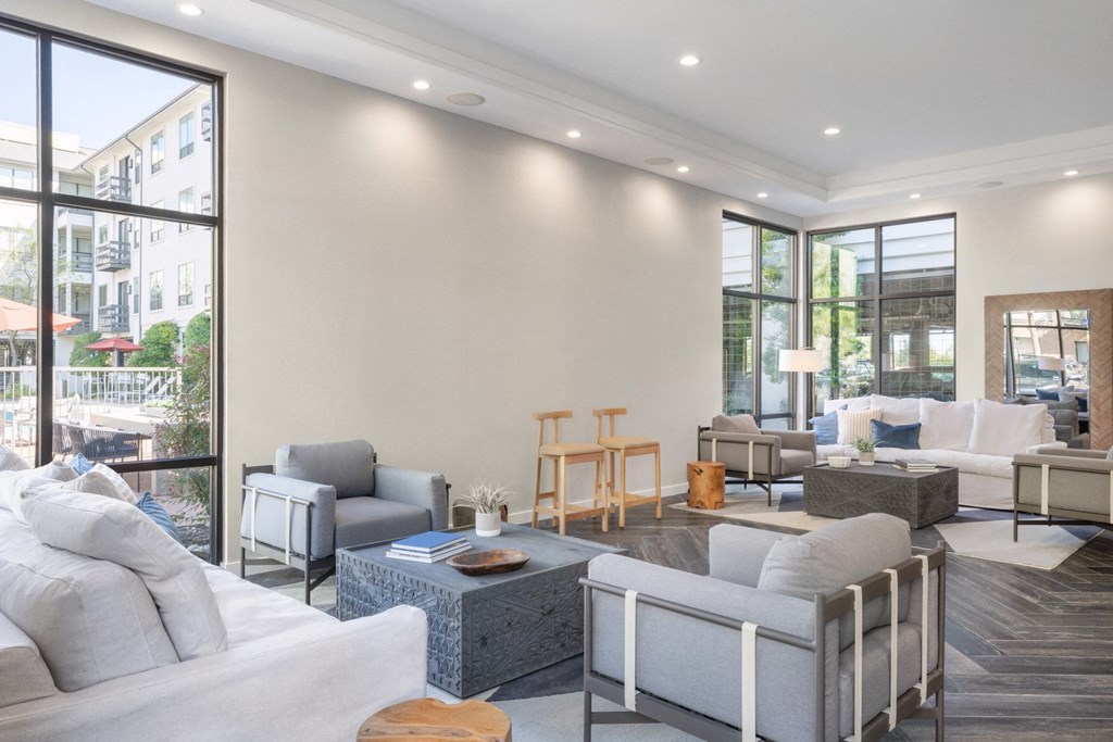 interior clubhouse longe with ample seating overlook pool