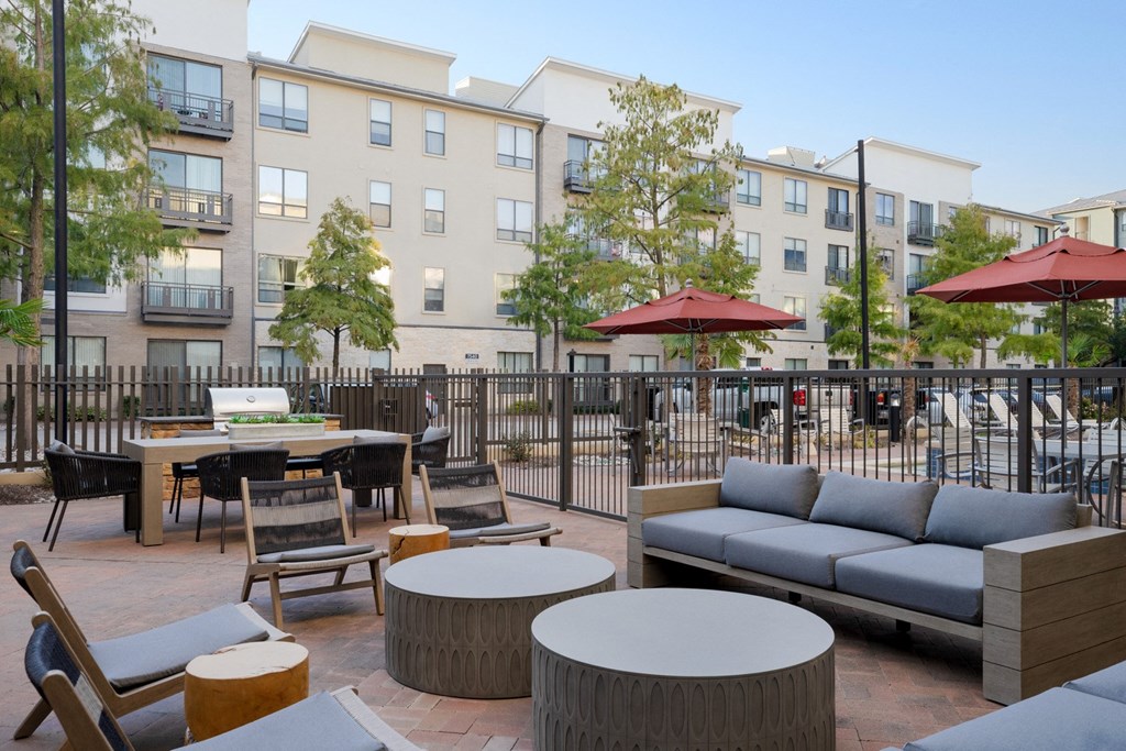 exterior pool seating with outdoor kitchen