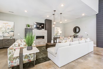 Clubroom with white couch and fireplace - Photo Gallery 4