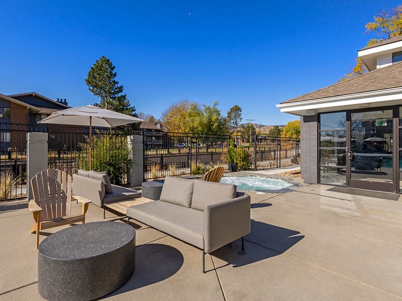 the preserve at ballantyne commons patio with chairs and tables and a pool