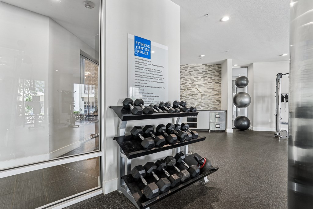 A gym with a sign that says "Fitness Centers" on it.