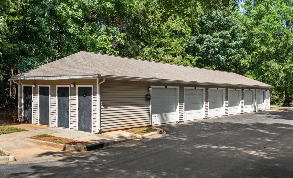 a small building with a row of garage doors