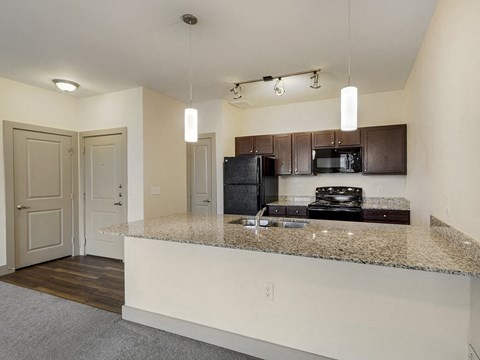a kitchen with a granite counter top and