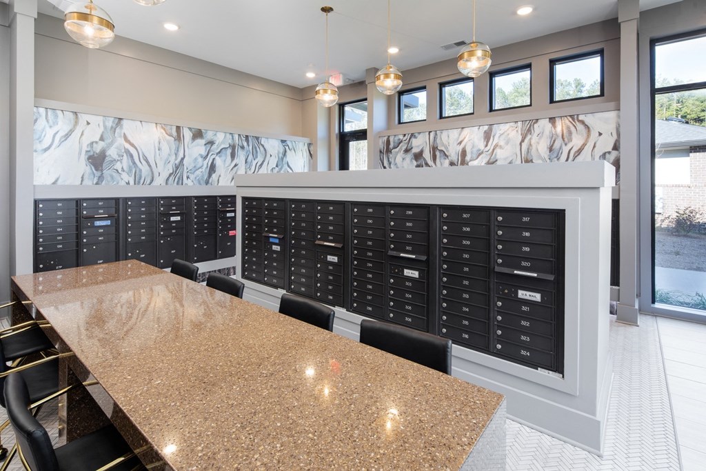 the tasting room has a granite counter top and a large