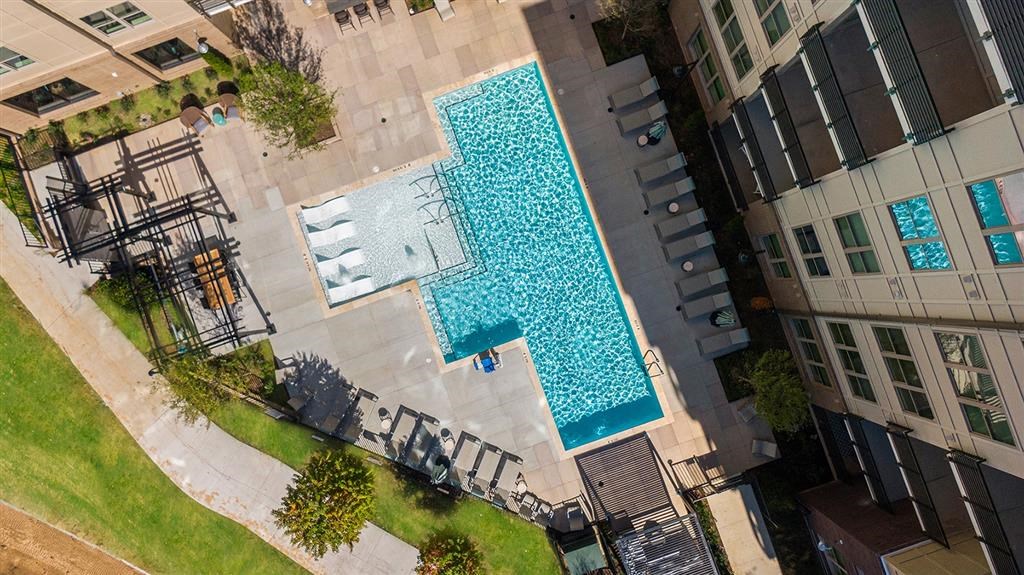 A swimming pool surrounded by buildings.