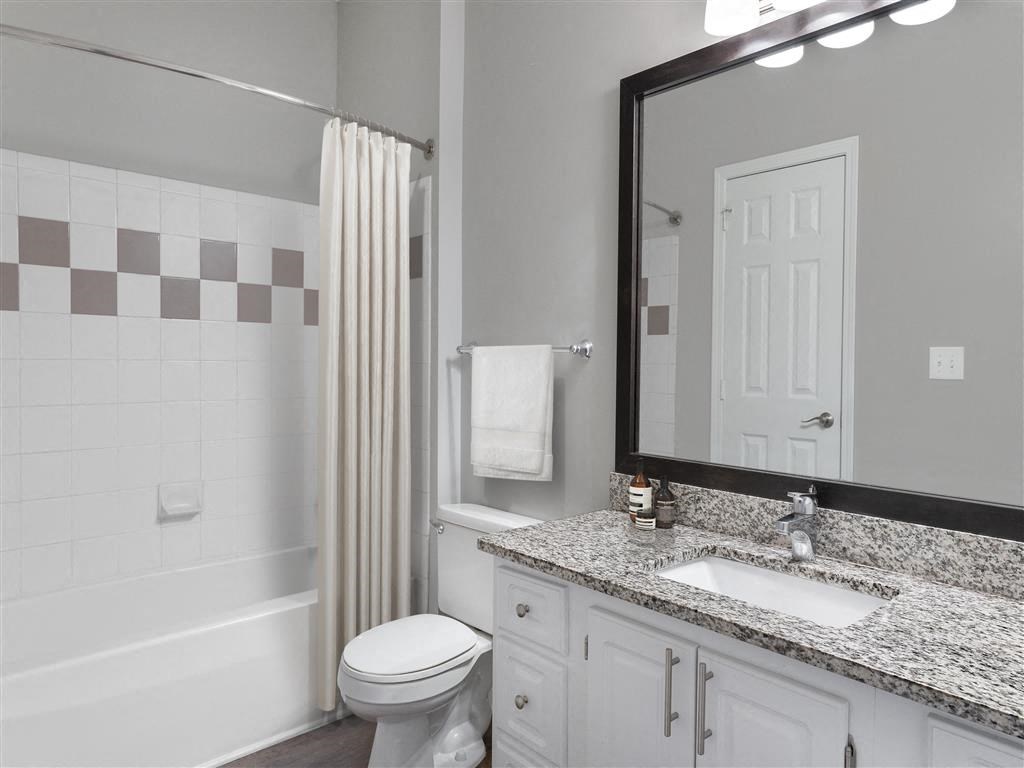a bathroom with a sink and shower