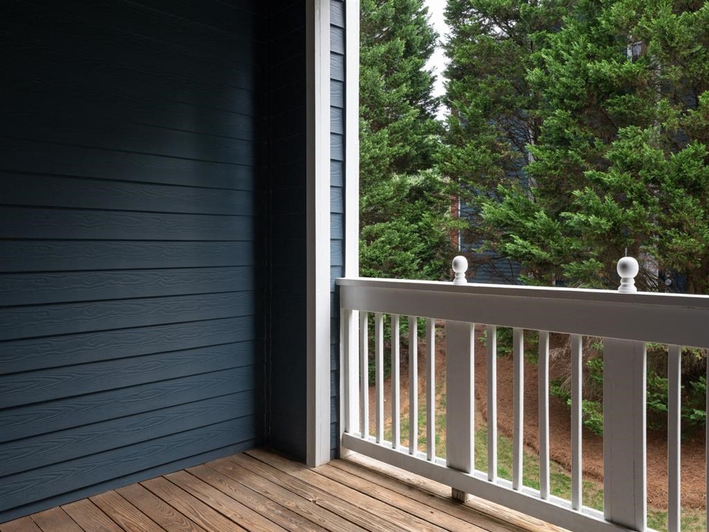 a balcony overlooking trees