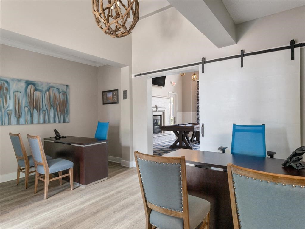 a leasing office with table and chairs