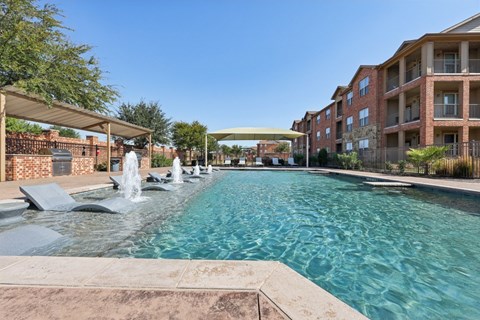 A long rectangular pool with a waterfall in the middle.