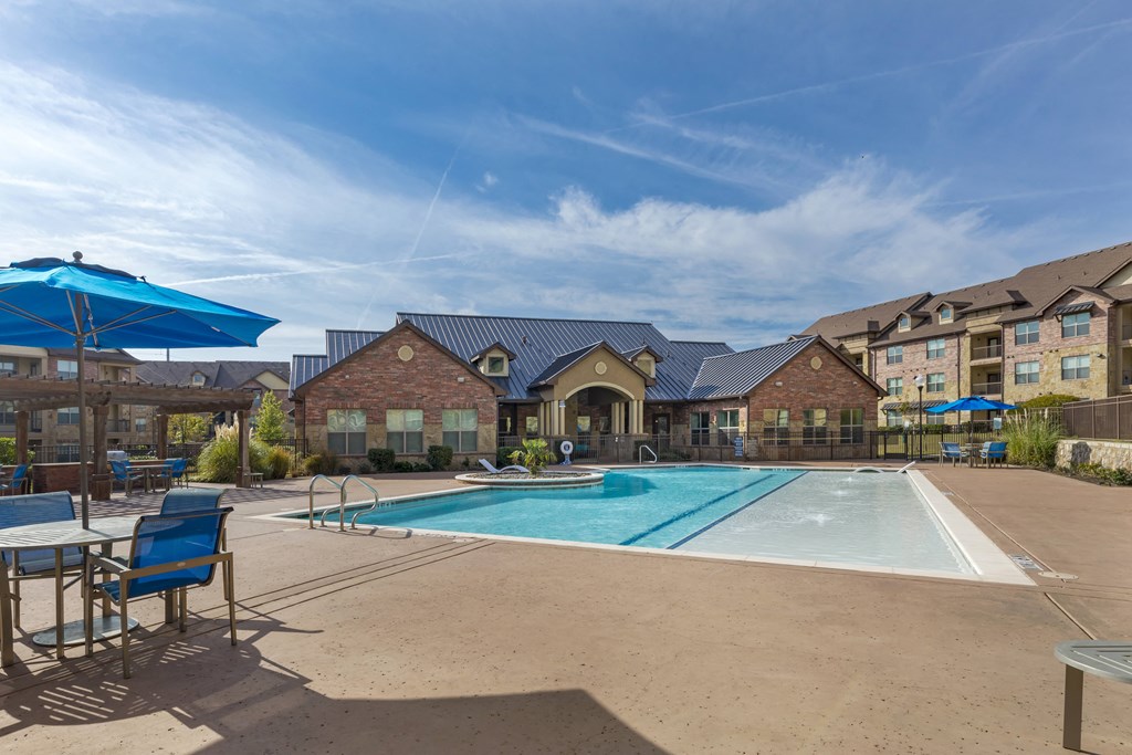 our apartments offer a swimming pool with chairs and umbrellas