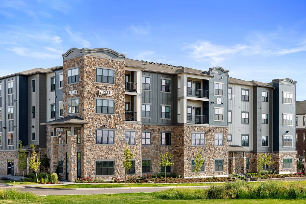 A large multi-story building with a stone facade and the words "Parkers" on the front.