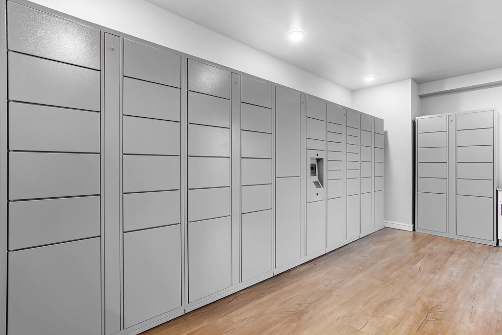 A row of grey lockers in a room.