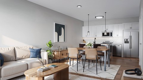 a living room with a couch and a table and a kitchen