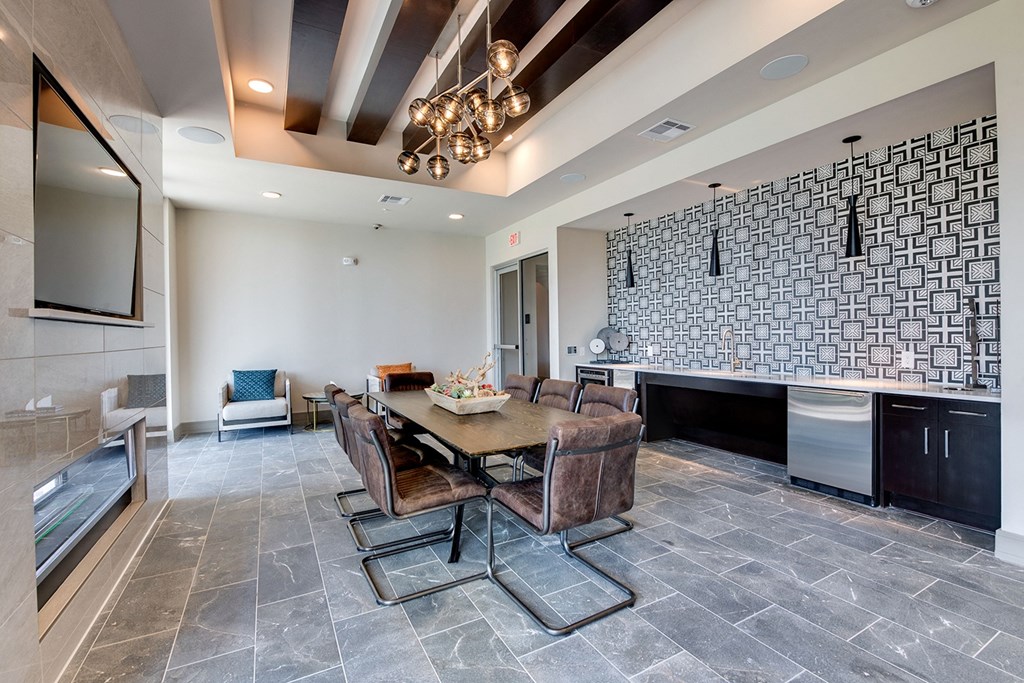 a dining room with a table and chairs