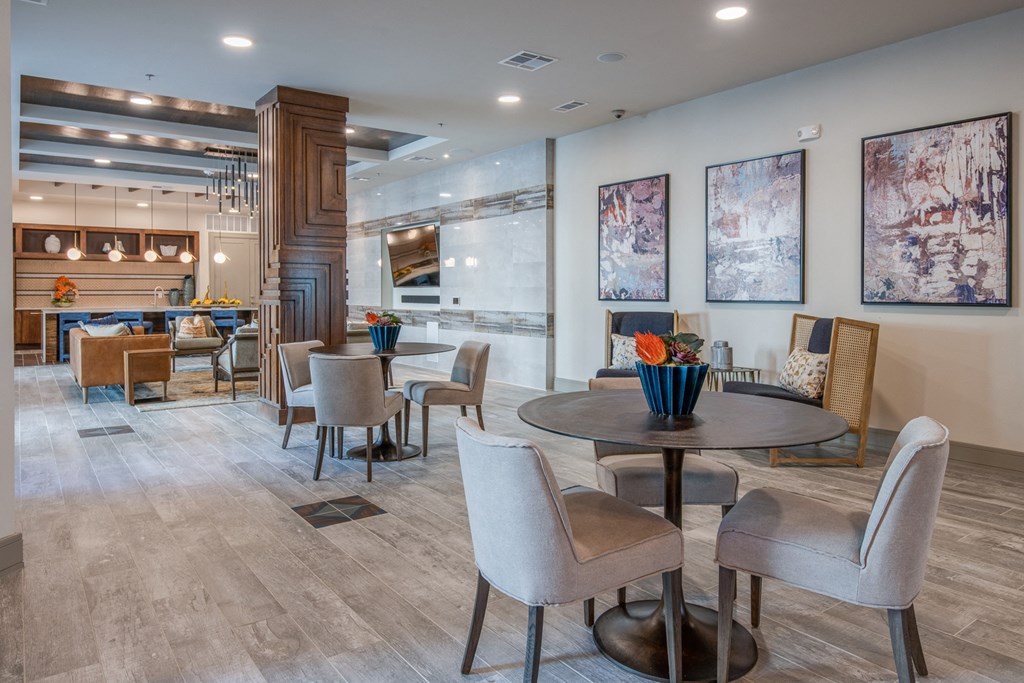 a dining room with tables and chairs and a bar