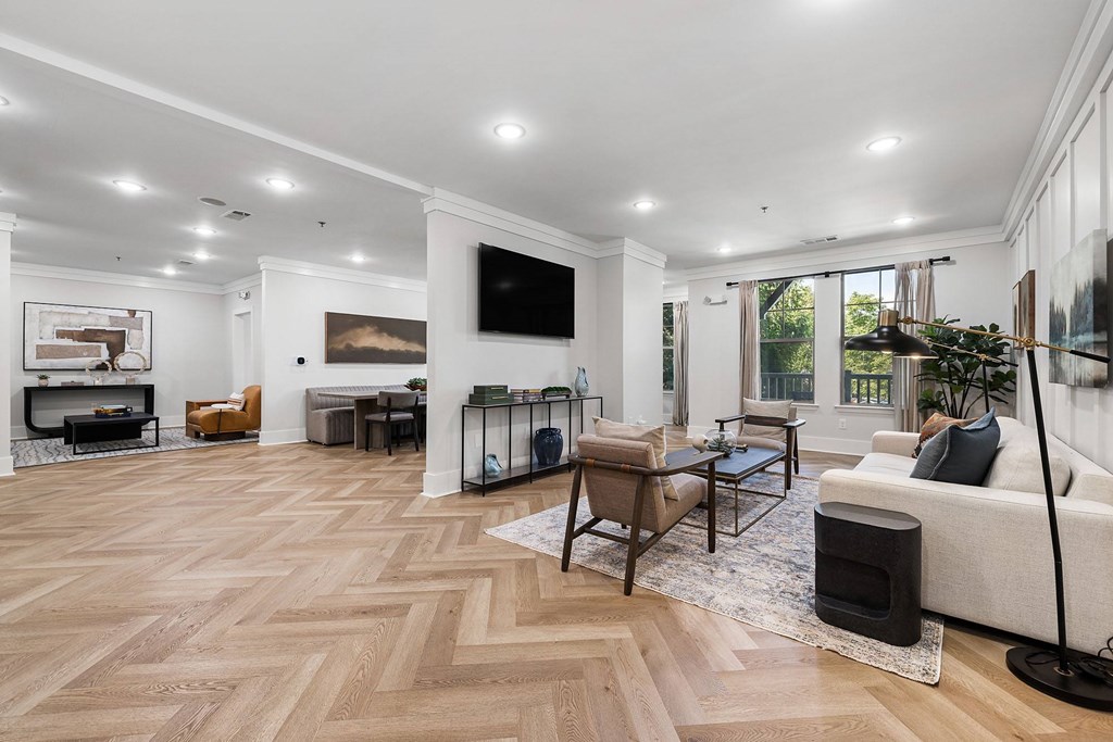 A living room with a fireplace and a TV mounted on the wall.