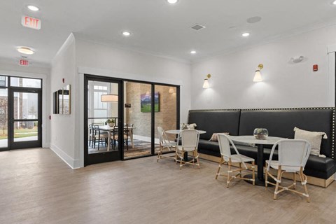 a dining room with a table and chairs