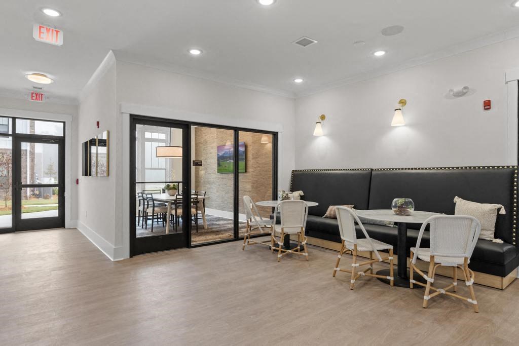 a dining room with a table and chairs