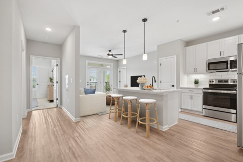A kitchen with a bar stool and a countertop.