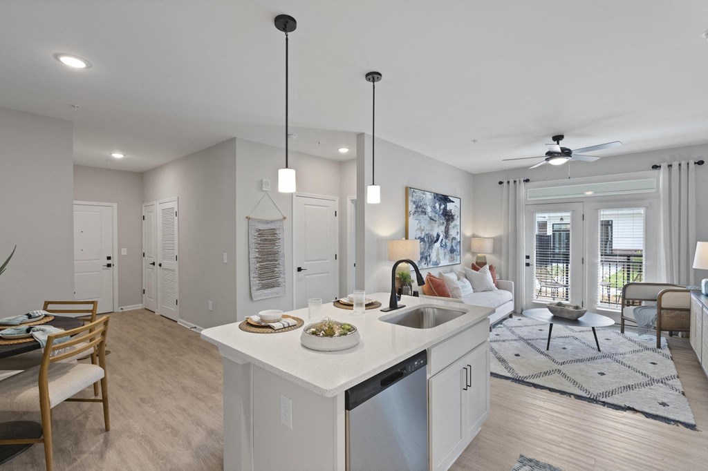 white kitchen going into living room