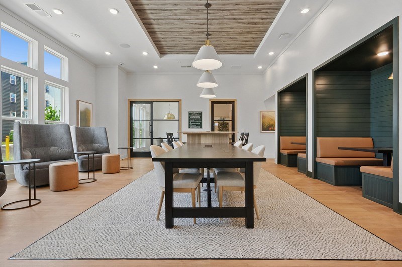 A room with a large table and chairs.