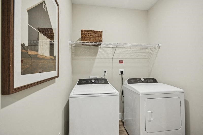 A laundry room with a washer and dryer.