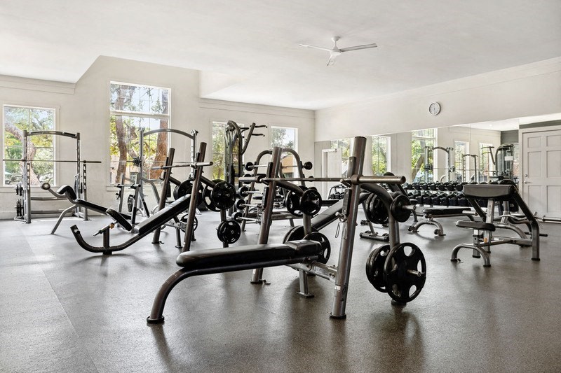 a gym with a lot of exercise equipment