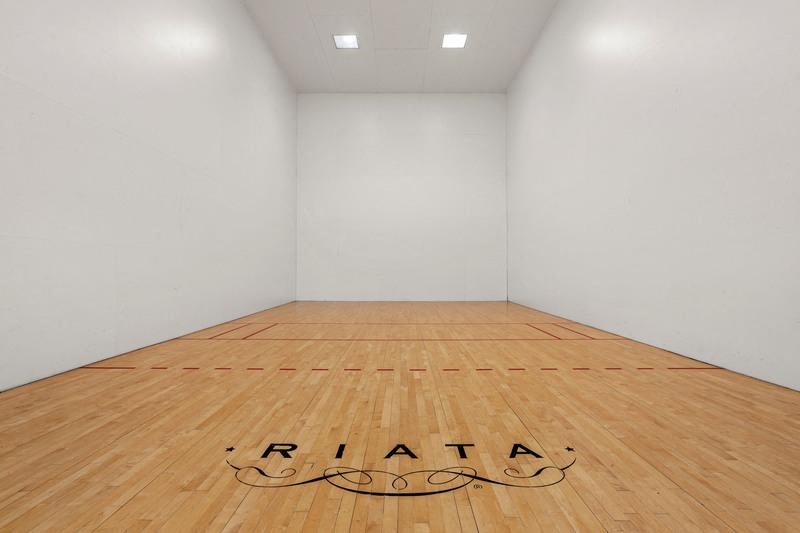 a racquetball court in a white room