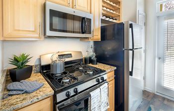 Stainless steel appliances including built-in microwave, refrigerator with icemaker, gas range, and dishwasher*