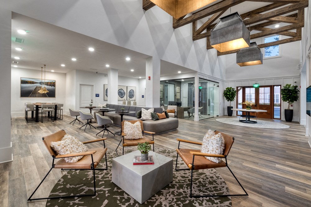 A modern living room with wooden floors and furniture.
